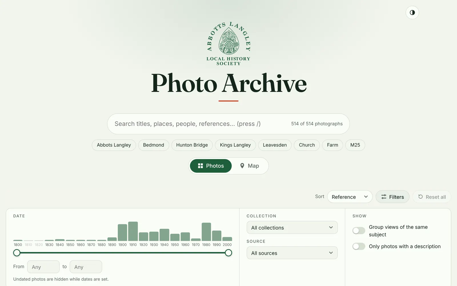 The rebuilt start page: society crest, a large search box, subject chips and a histogram of photos by decade.